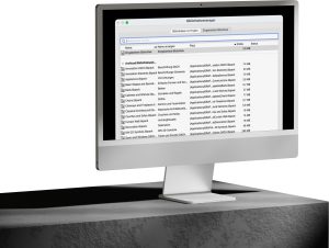 Ein Desktop-Computer zeigt ein Dateimanager-Fenster mit einer Liste von Dateien, einschließlich Archicad-Projektdokumenten und Ressourcen aus der Globalen Bibliothek, mit Details wie Name, Typ und Größe.