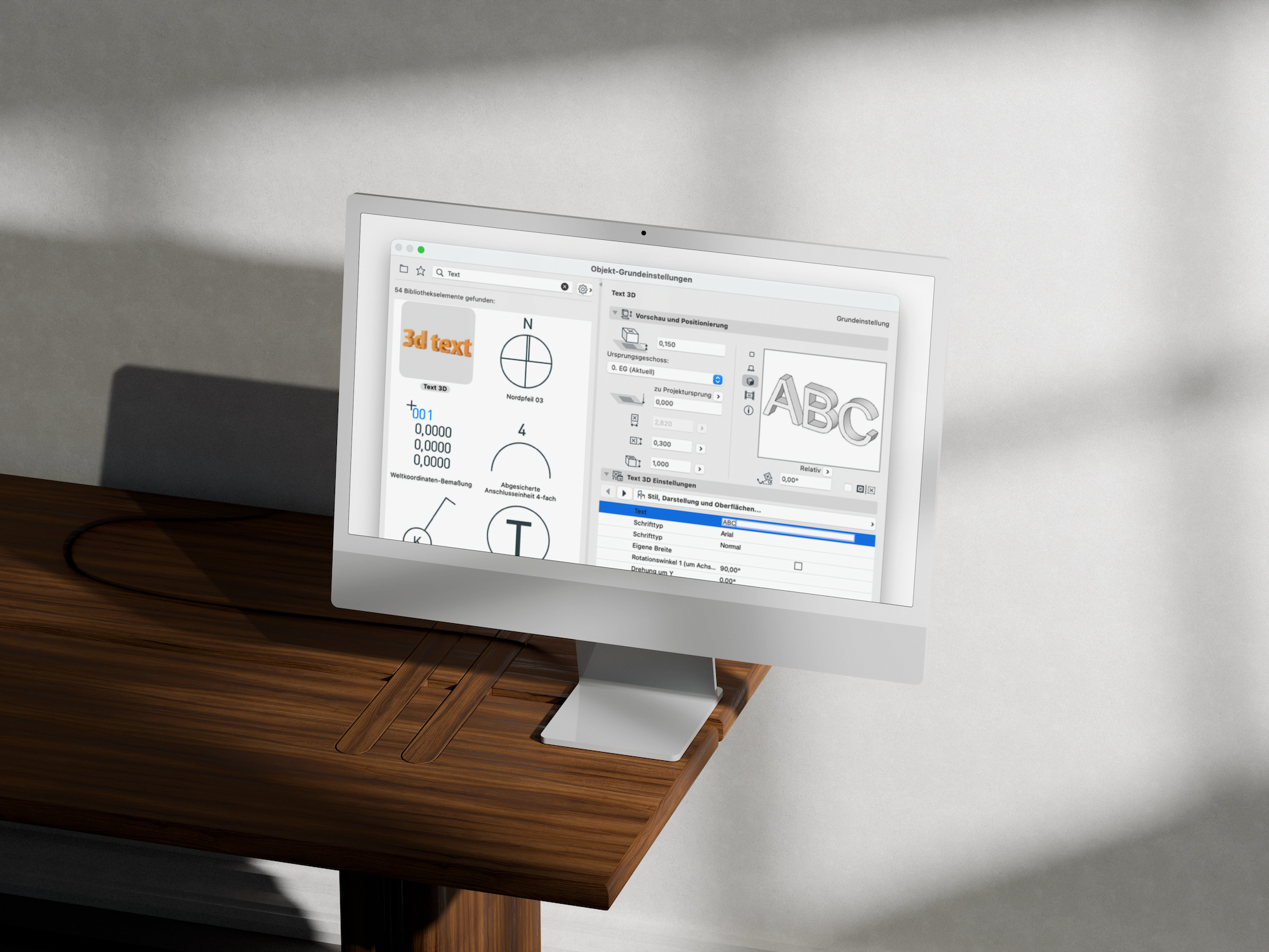 Auf einem Computermonitor auf einem Holztisch ist eine Gestaltungssoftware mit verschiedenen Schrift- und Textbearbeitungswerkzeugen zu sehen, darunter auch Funktionen zum Bibliotheken organisieren.