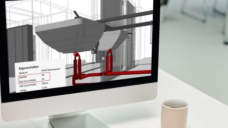 Eine Person verwendet einen Computer in einem Büro und arbeitet an einem Waschbecken und plant die Sanitären Anlagen im Architektur Entwurf.