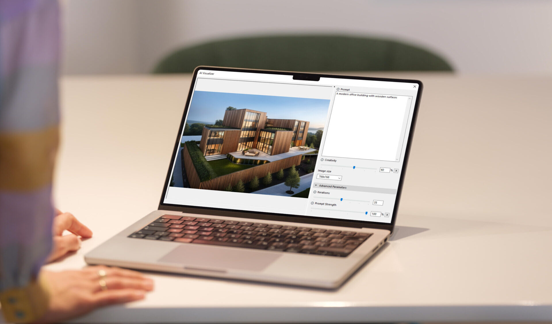 Person, die neben einem Tisch steht und einen Laptop verwendet, auf dem Architekturdesignsoftware angezeigt wird.